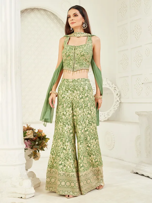 Bright green sleeveless silk palazzo suit with stone work