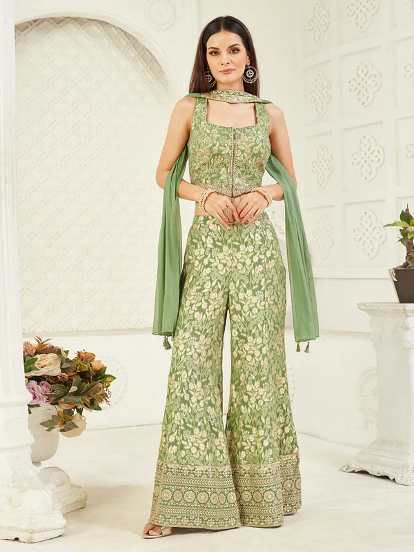 Bright green sleeveless silk palazzo suit with stone work