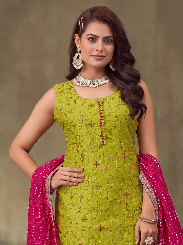 Bright green sleeveless silk suit for festive wear