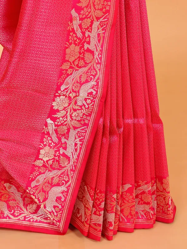 Bright pink silk saree with heavy zari work