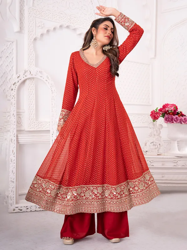 Bright red pakistani georgette palazzo suit with zari work