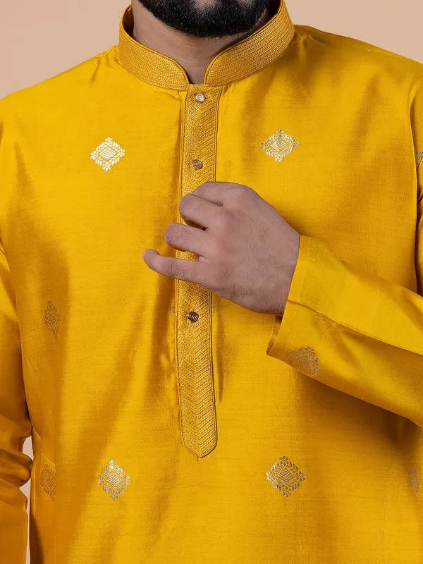 Bright yellow raw silk zari work kurta suit