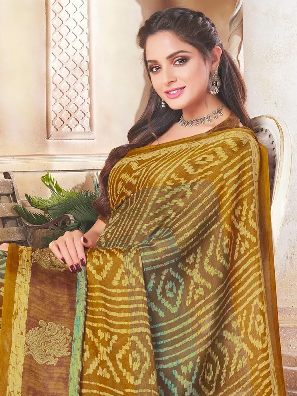 Brown and yellow alluring festive wear saree in crepe
