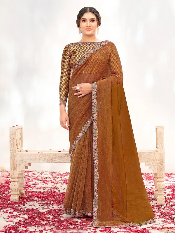 Brown crepe saree with subtle bead embroidery work