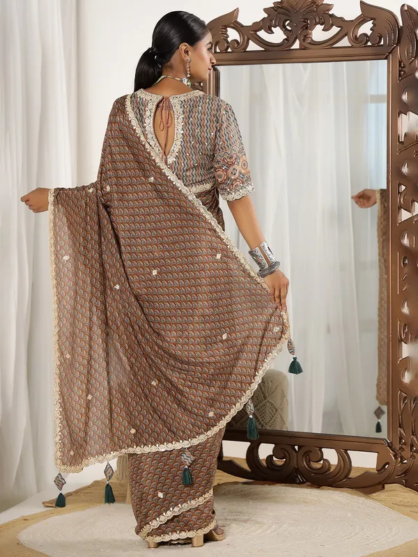 Brown muslin saree with ready made blouse