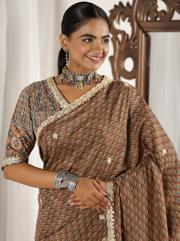 Brown muslin saree with ready made blouse