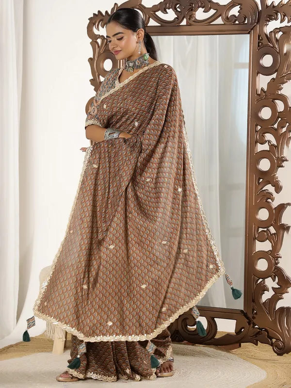 Brown muslin saree with ready made blouse