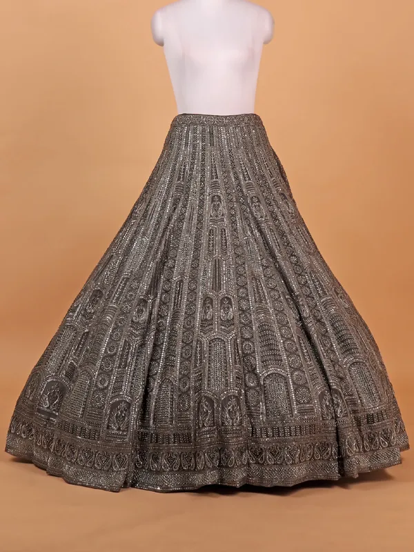 Brown net lehenga choli with heavy embellishment