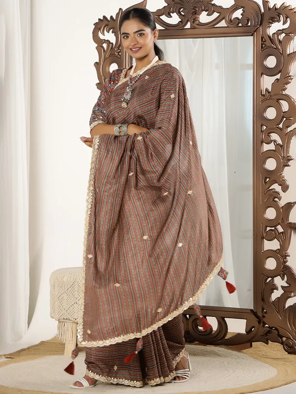 Brown printed festive style muslin saree