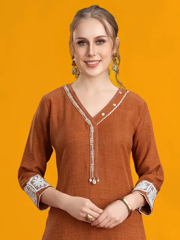 Brown silk pant set with cowrie and thread
