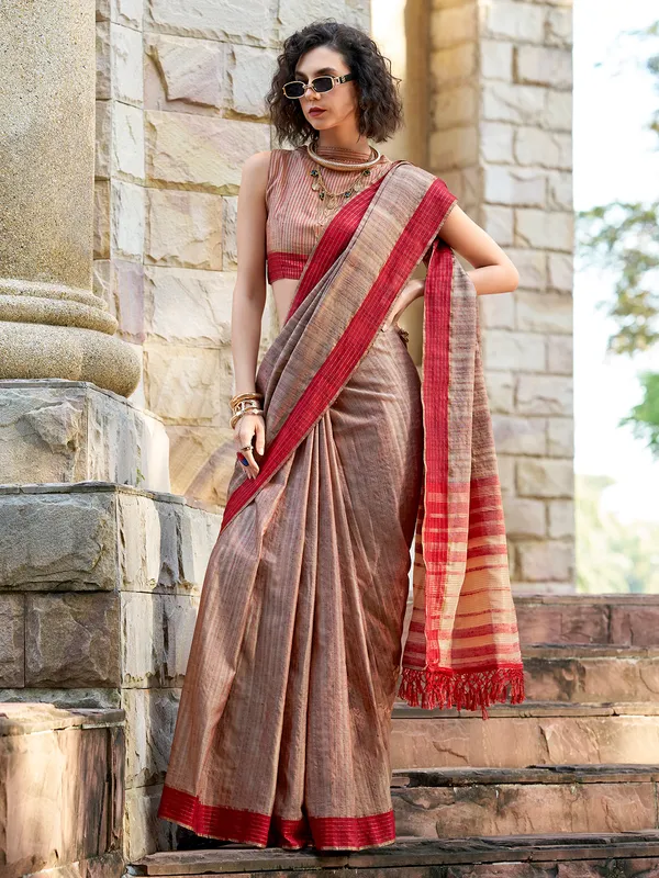 Brown silk saree adorned with zari work