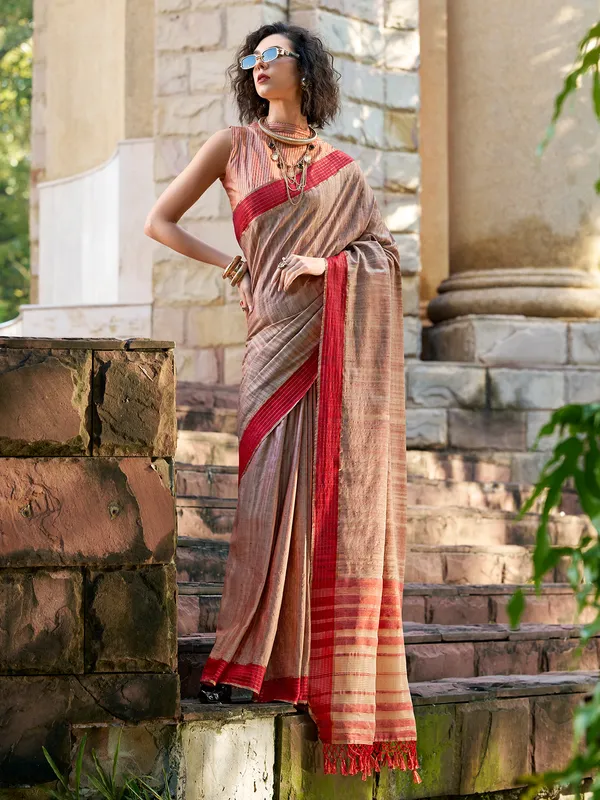 Brown silk saree adorned with zari work