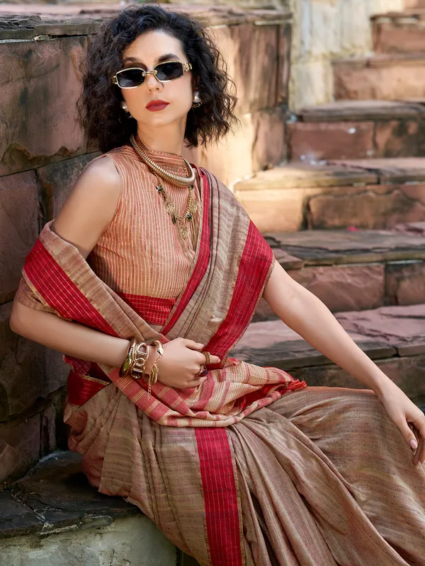 Brown silk saree adorned with zari work