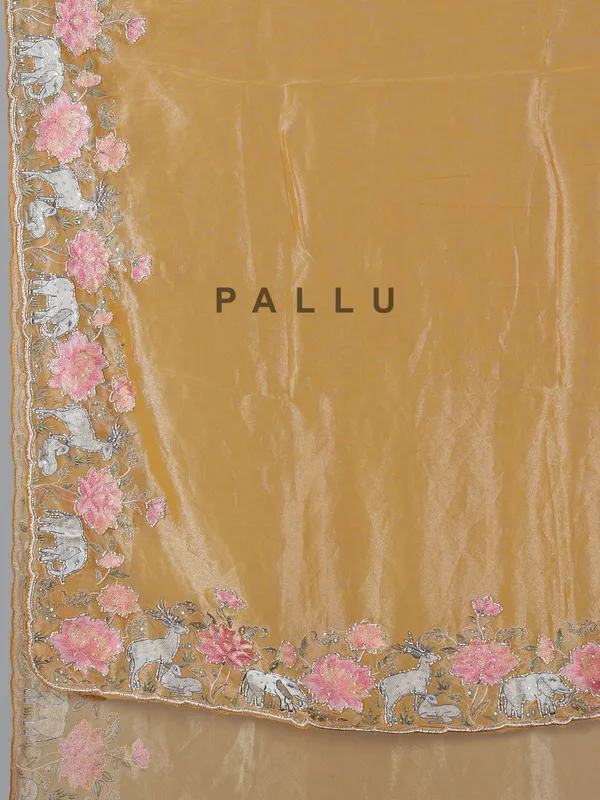 Brown tissue silk saree with elephant embroidered charm