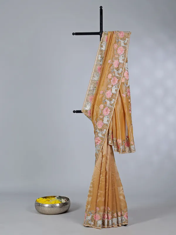 Brown tissue silk saree with elephant embroidered charm