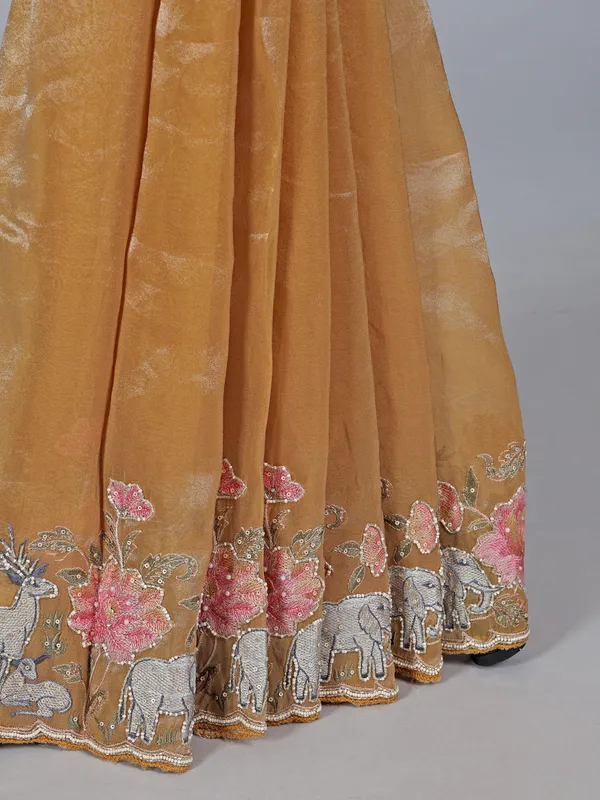 Brown tissue silk saree with elephant embroidered charm