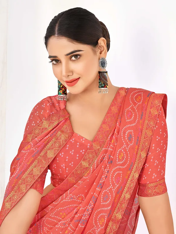 Coral pink chiffon printed saree