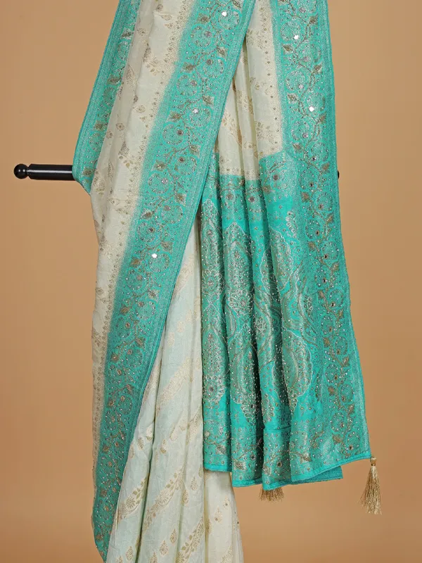 Cream and aqua dola silk wedding wear saree