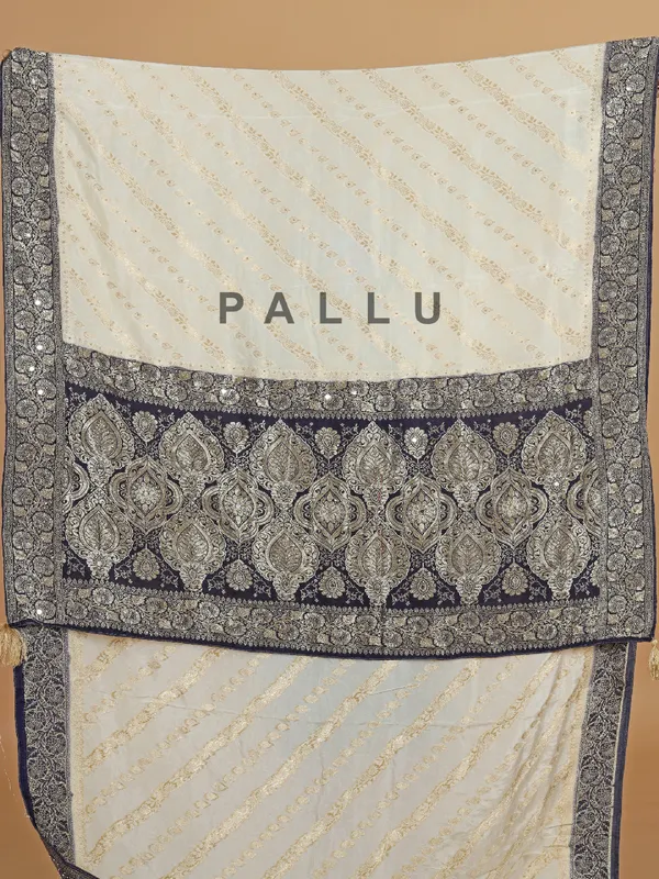 Cream and blue dola silk saree with zari weaving