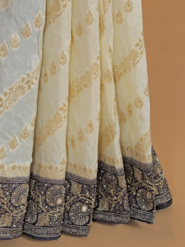 Cream and blue dola silk saree with zari weaving