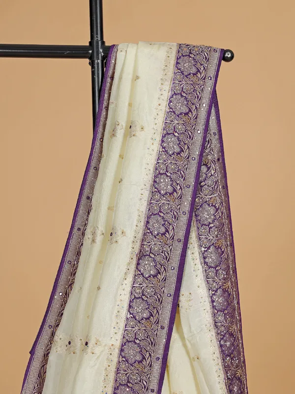 Cream and purple dola silk saree with zari work