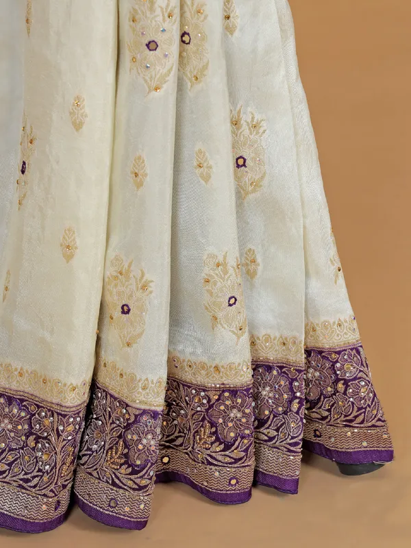 Cream and purple dola silk saree with zari work