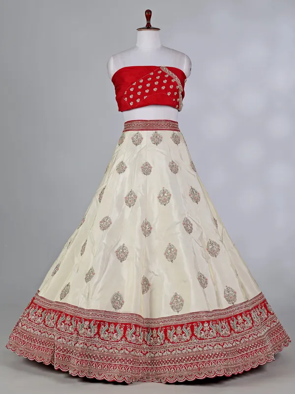 Cream and red silk lehenga choli with zardosi work