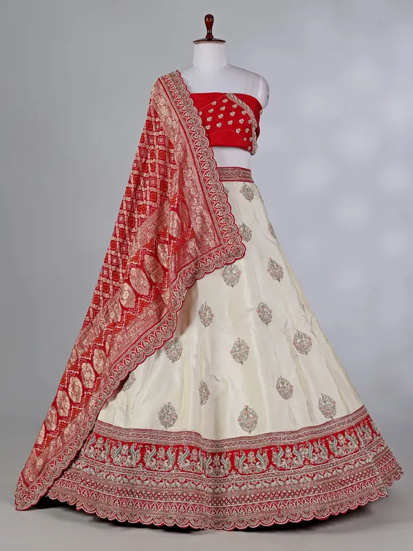 Cream and red silk lehenga choli with zardosi work