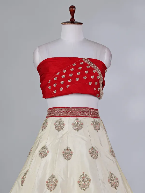 Cream and red silk lehenga choli with zardosi work