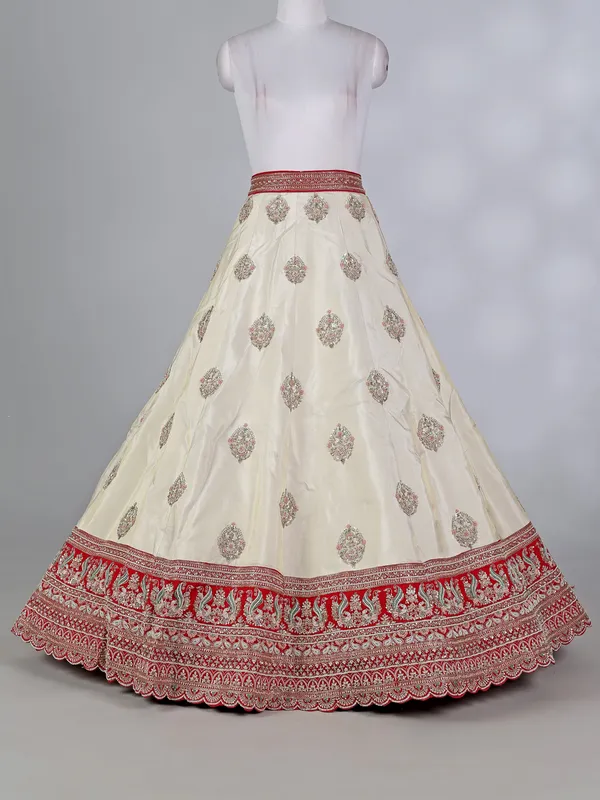 Cream and red silk lehenga choli with zardosi work