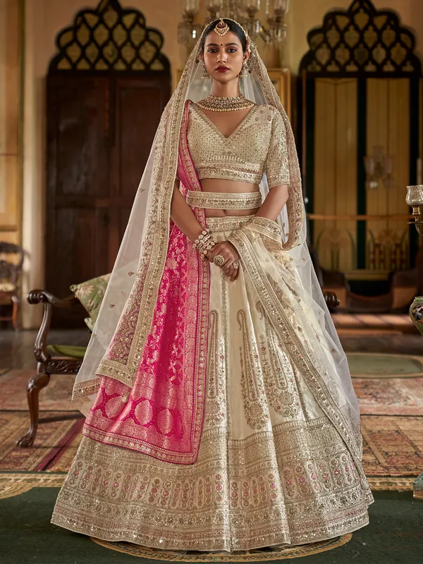 Cream bridal lehenga choli with two dupatta