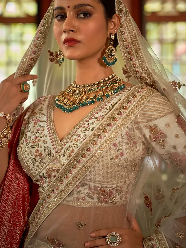 Cream bridal silk lehenga choli with with red banarasi dupatta