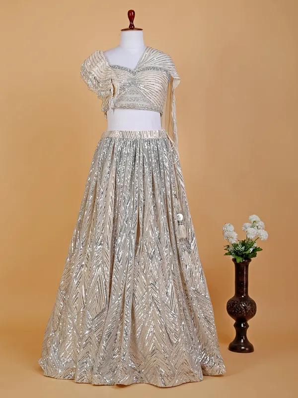 Cream designer lehenga choli in net