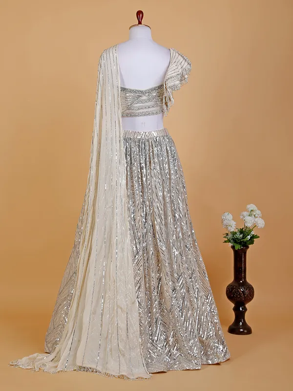 Cream designer lehenga choli in net