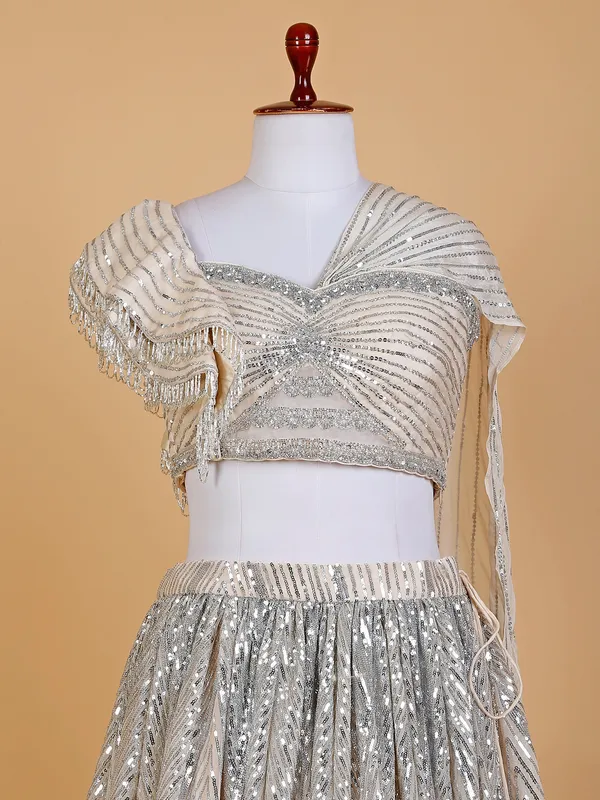 Cream designer lehenga choli in net