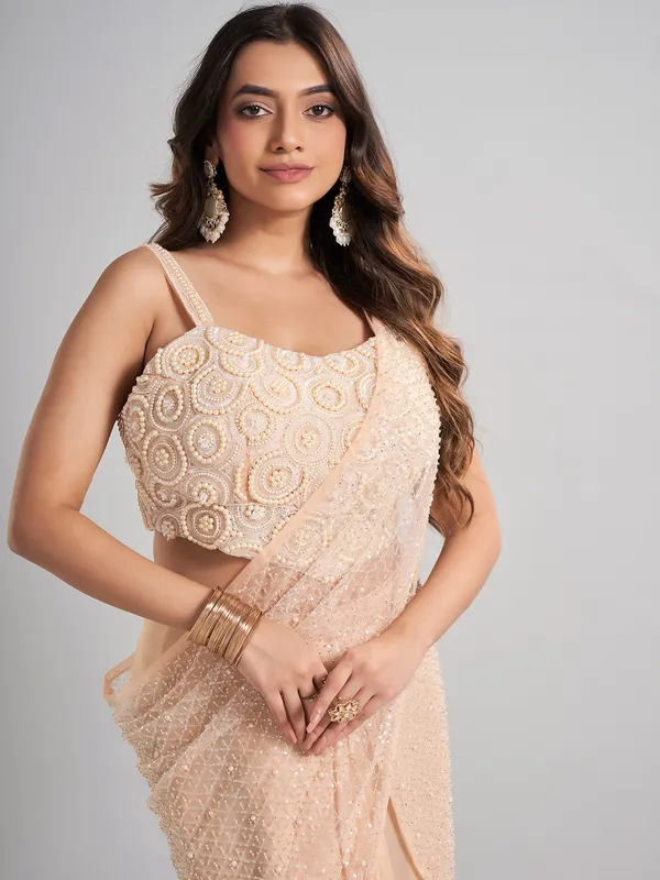 Cream designer ready to wear saree for elegant celebrations