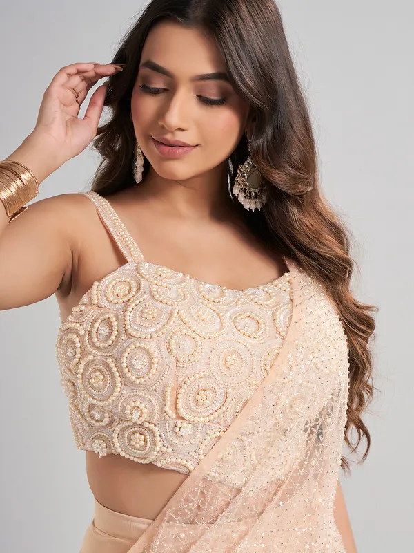 Cream designer ready to wear saree for elegant celebrations