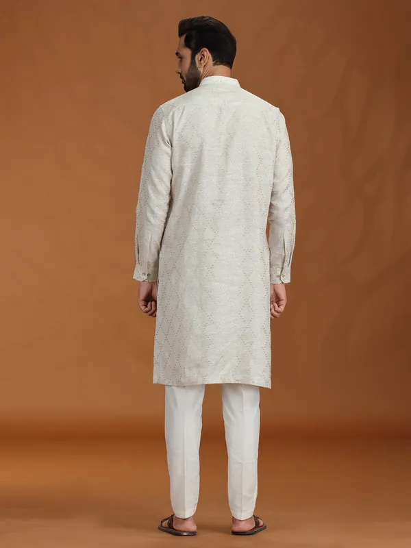 Cream embroidered kurta set with linen fabric