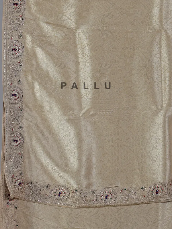 Cream embroidered tissue silk saree