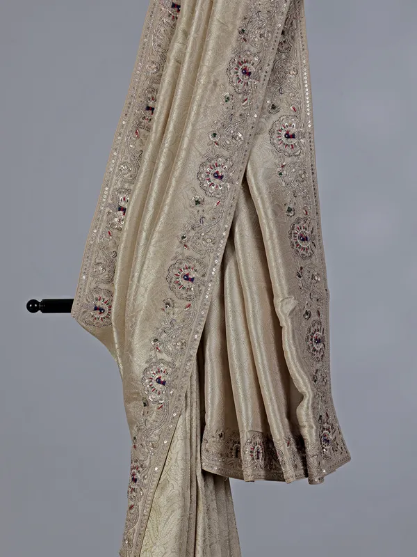 Cream embroidered tissue silk saree
