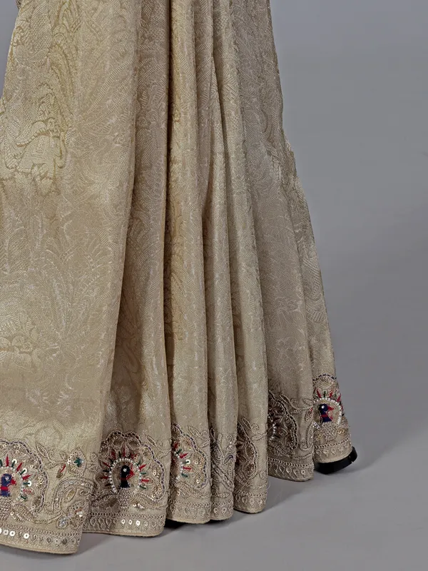 Cream embroidered tissue silk saree