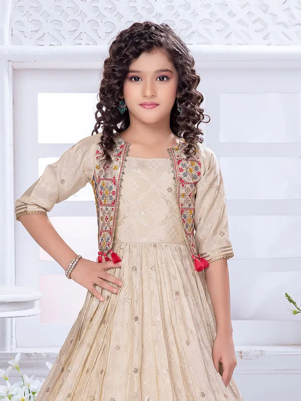 Cream fabulous gown in silk with heavy work for girls