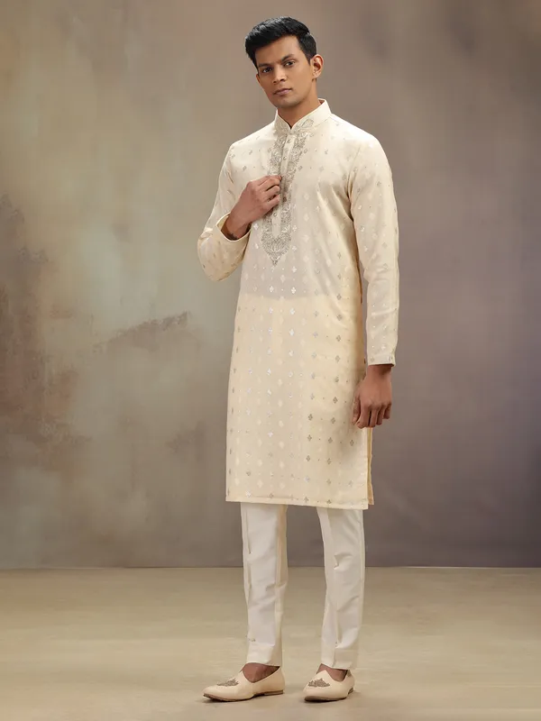 Cream festive wear kurta suit with rich embellishment