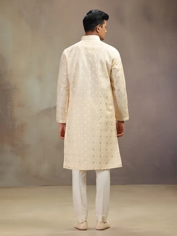 Cream festive wear kurta suit with rich embellishment