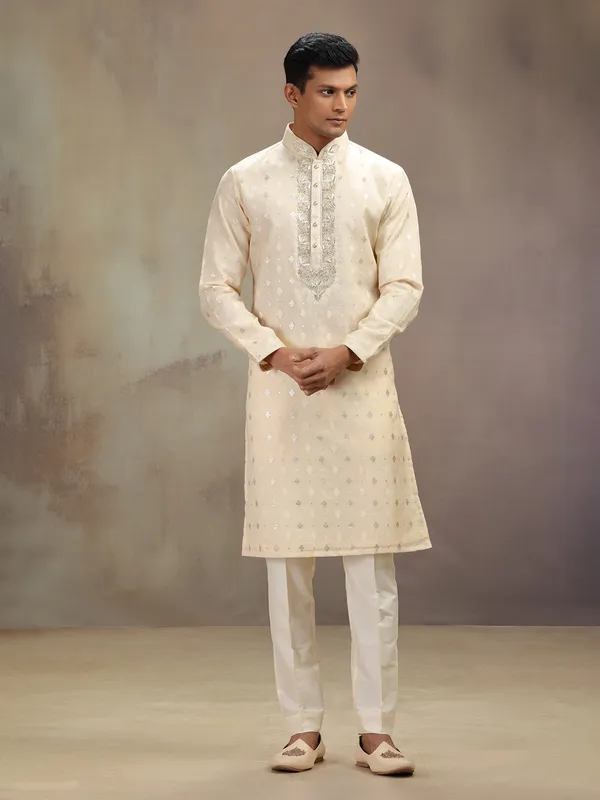 Cream festive wear kurta suit with rich embellishment