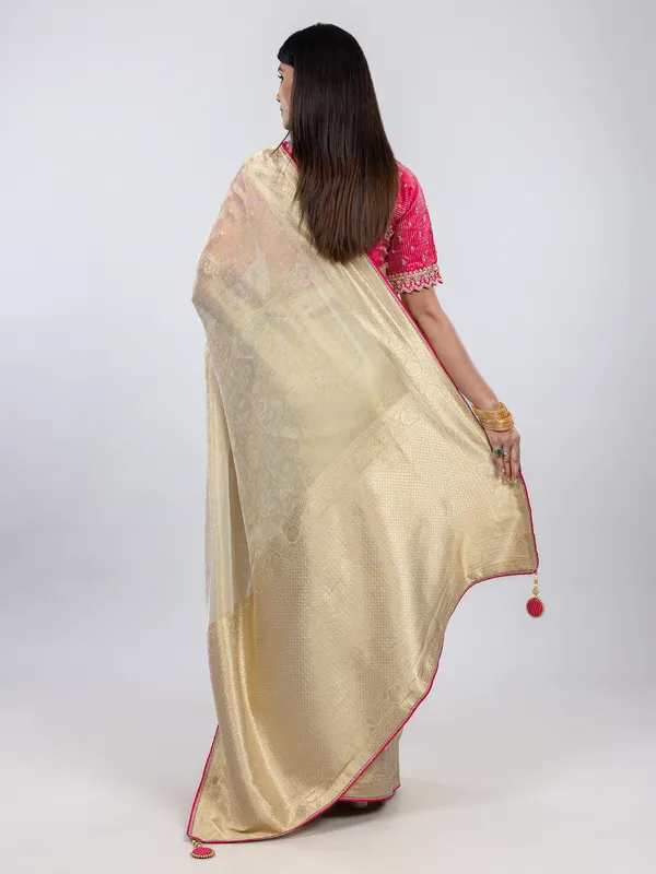 Cream festive wear saree in shimmer tissue silk