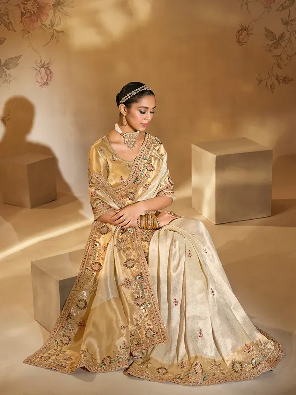 Cream festive wear silk saree with resham work