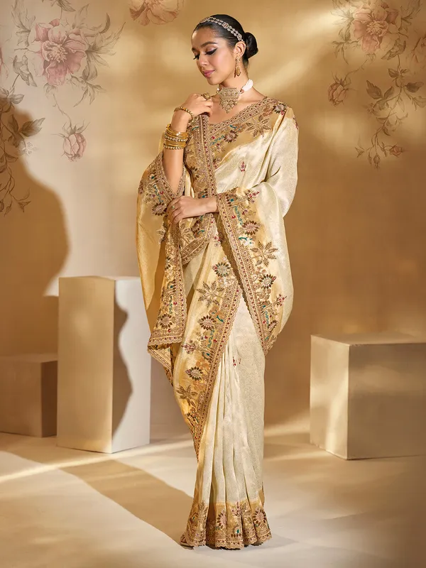 Cream festive wear silk saree with resham work