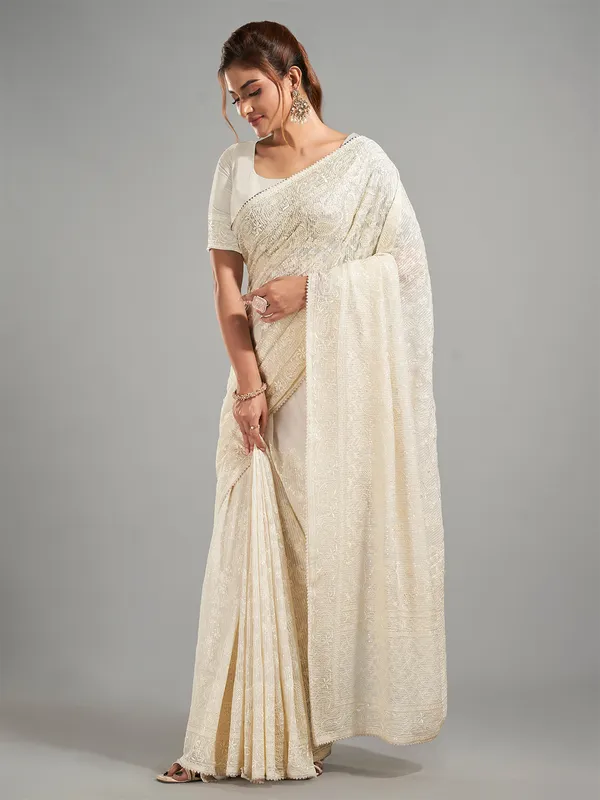 Cream georgette embroidery saree