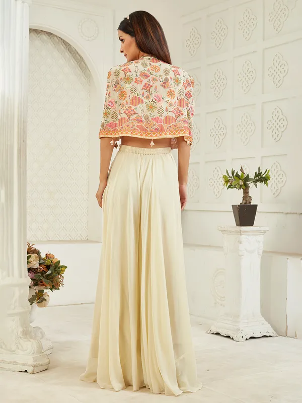 Cream georgette jacket palazzo suit with cowrie shells